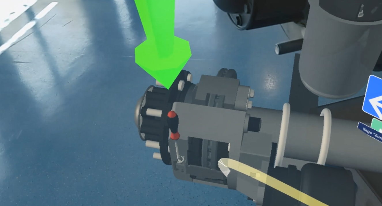 das Bild zeigt Arbeiten an einer virtuellen LKW-Achse durch eine AR-Brille gesehen das Bild zeigt Arbeiten an einer virtuellen LKW-Achse durch eine AR-Brille gesehen